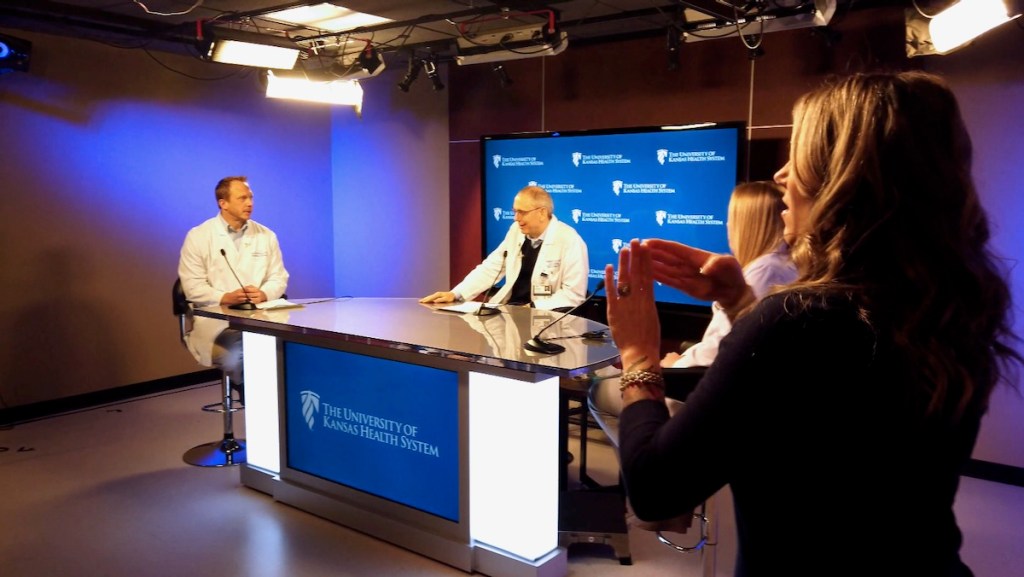 The University of Kansas Health System doctors during an episode of the institution's daily news program.
